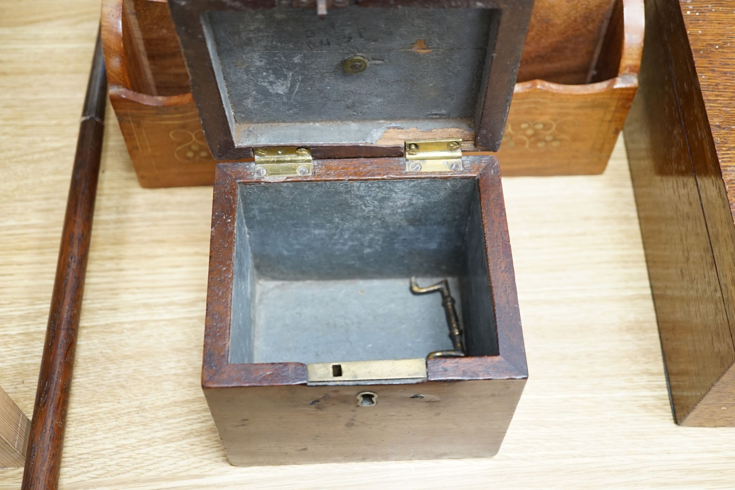 A Georgian square mahogany tea caddy, a brass inlaid hardwood stationary rack and box, and sundry items